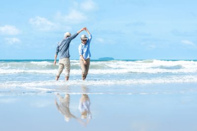 mature couple dancing on the beach